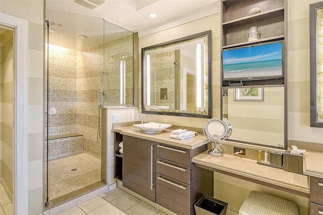 bathroom with tile flooring, an enclosed shower, and vanity