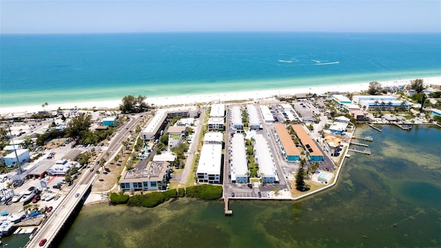 bird's eye view featuring a view of the beach and a water view