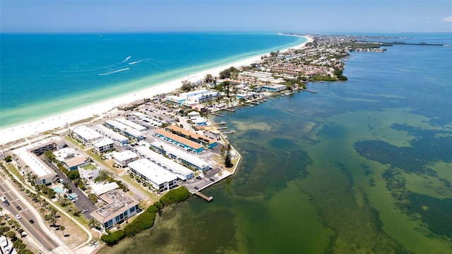 drone / aerial view with a beach view and a water view