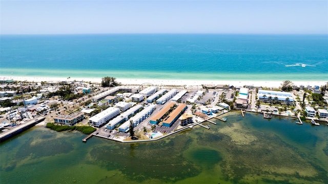 birds eye view of property with a beach view and a water view