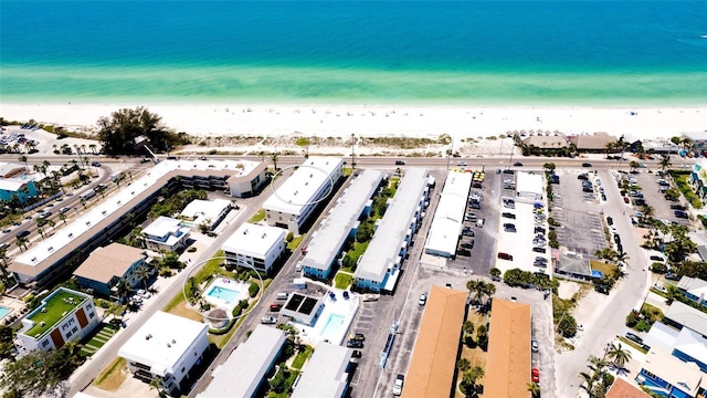 bird's eye view featuring a beach view and a water view