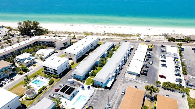 aerial view featuring a water view and a view of the beach