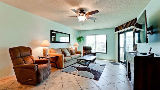 tiled living room with ceiling fan and a textured ceiling