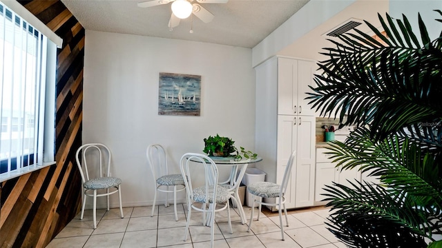 interior space with ceiling fan and a patio