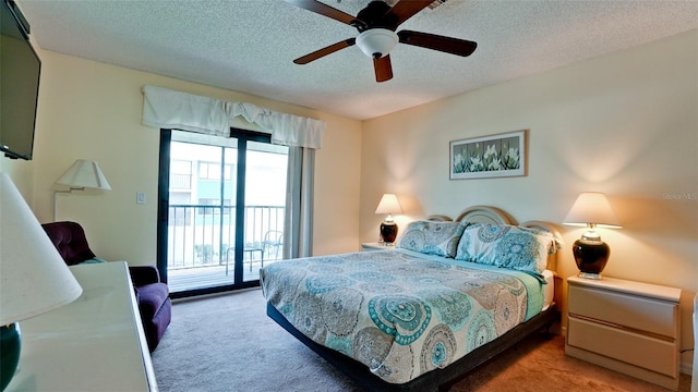 carpeted bedroom featuring a textured ceiling, access to exterior, and ceiling fan