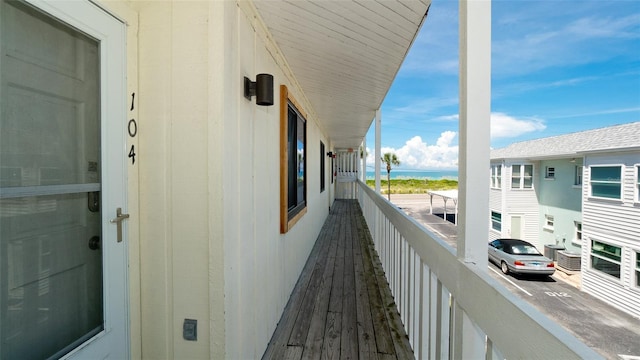 balcony featuring a water view