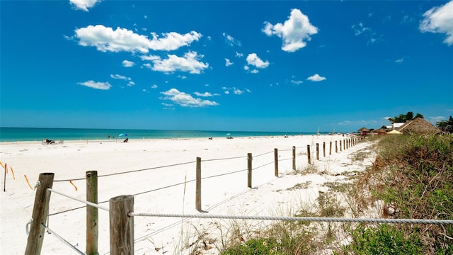 property view of water featuring a beach view