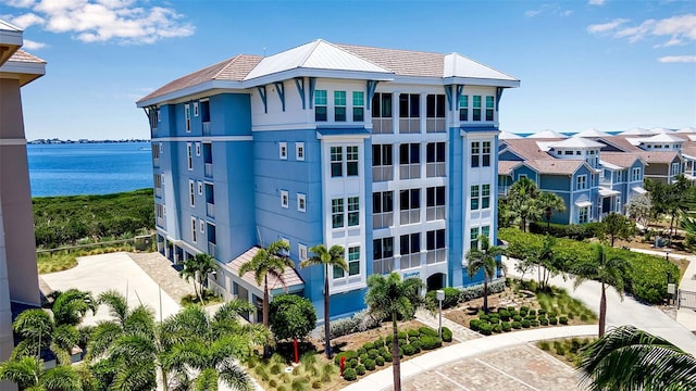 view of building exterior with a water view