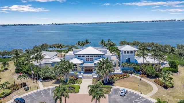 birds eye view of property with a water view