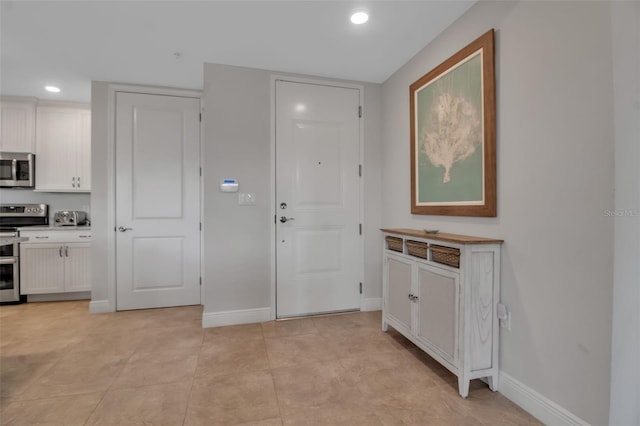 foyer entrance featuring light tile patterned floors