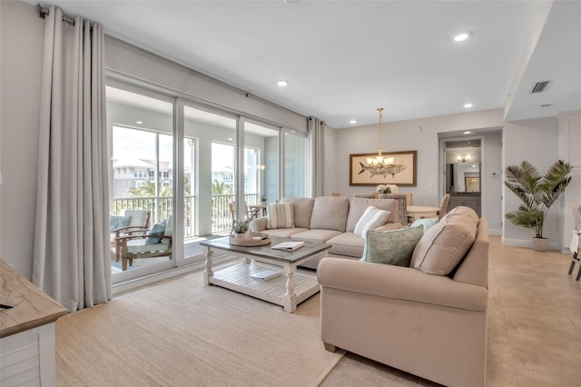 living room featuring a notable chandelier