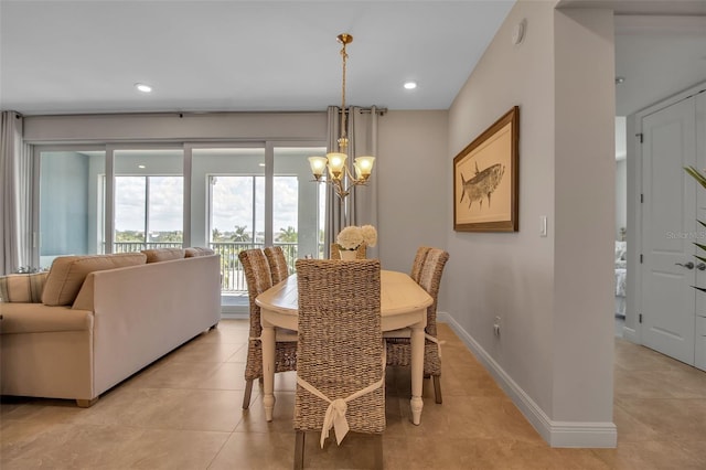 tiled dining room featuring a notable chandelier