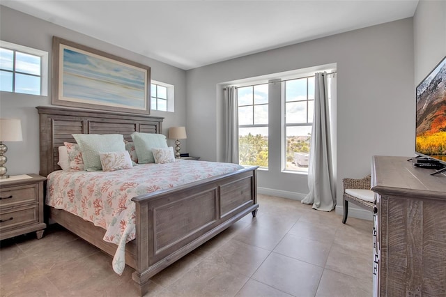 bedroom featuring light tile patterned floors