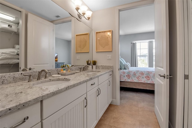 bathroom featuring tile patterned floors and vanity