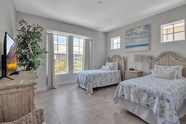 tiled bedroom with multiple windows