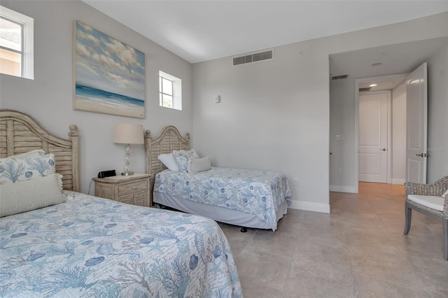 bedroom featuring multiple windows