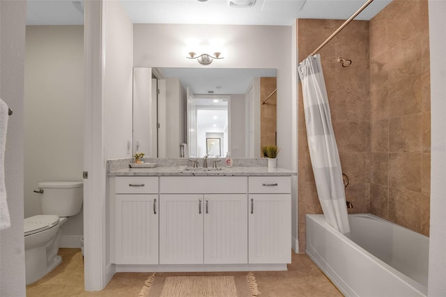 full bathroom with tile patterned flooring, shower / tub combo, vanity, and toilet