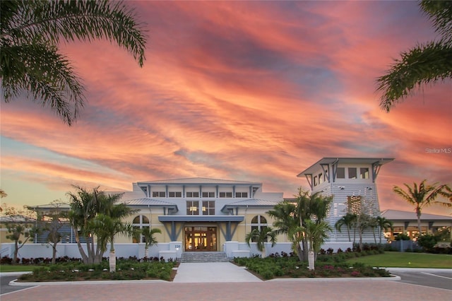 view of outdoor building at dusk