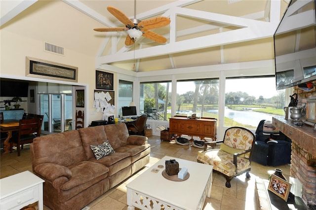 sunroom / solarium featuring lofted ceiling with beams and ceiling fan