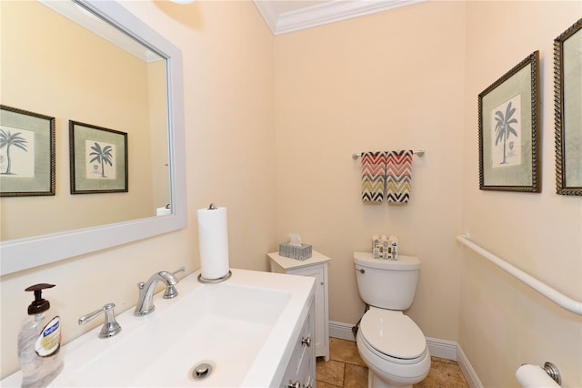 bathroom featuring ornamental molding, vanity, and toilet