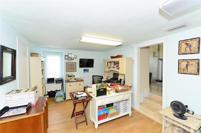 office space with light wood-type flooring