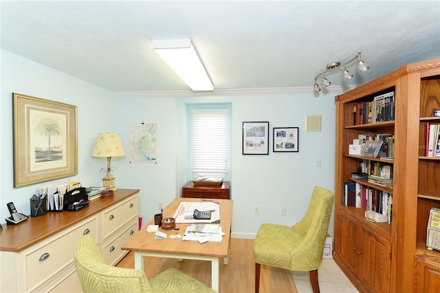 home office featuring light hardwood / wood-style flooring and ornamental molding