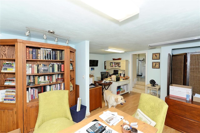 office area with light hardwood / wood-style floors