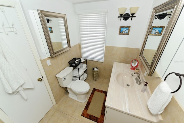 bathroom featuring tile walls, tile patterned floors, vanity, and toilet