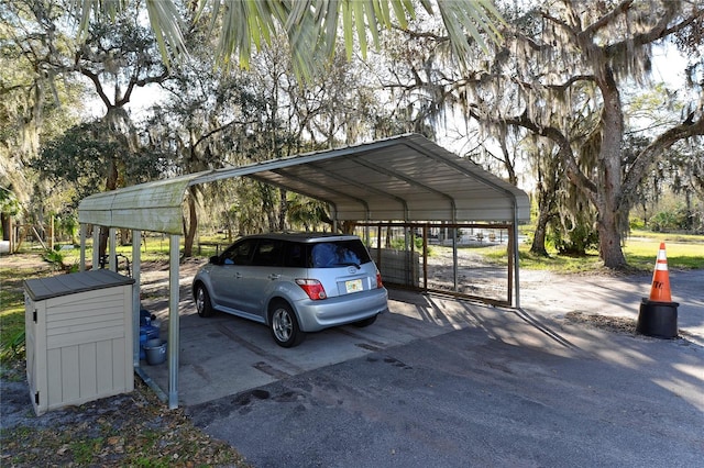 view of vehicle parking with a carport