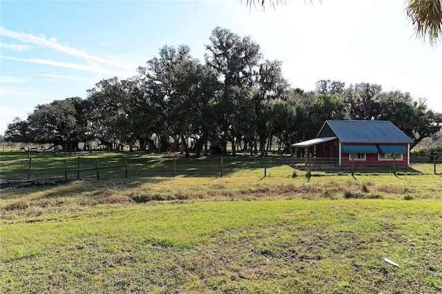 view of yard with a rural view