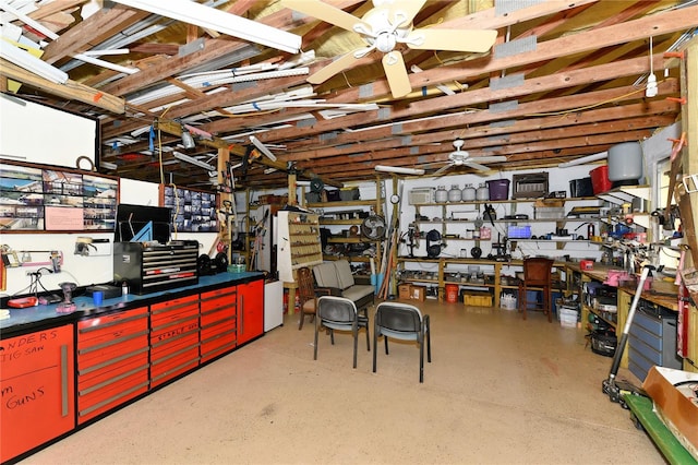 basement featuring ceiling fan and a workshop area