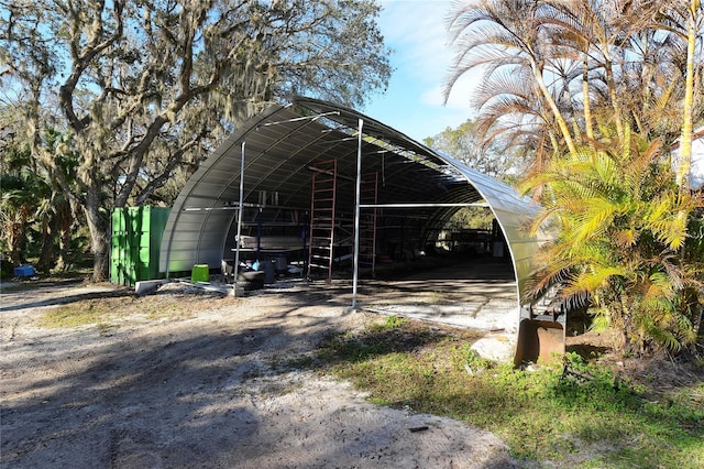 view of parking / parking lot with a carport