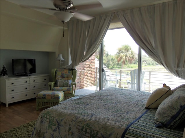 bedroom with access to exterior, hardwood / wood-style floors, and ceiling fan