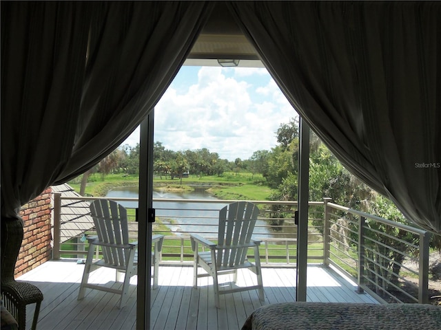 wooden terrace with a water view