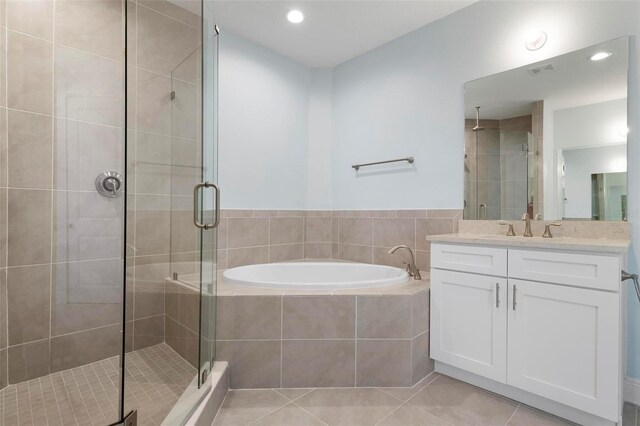 bathroom featuring vanity, tile patterned floors, and independent shower and bath