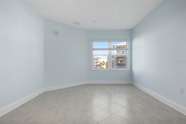 empty room featuring light tile patterned floors