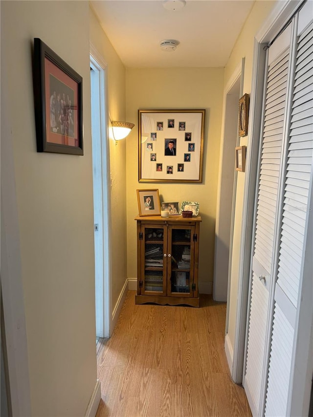 corridor featuring light hardwood / wood-style floors