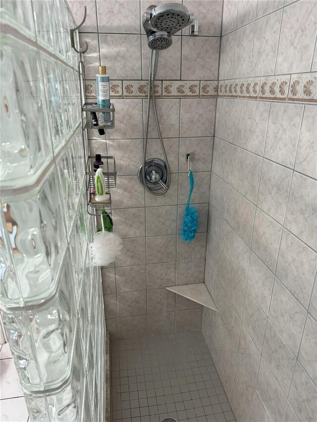 bathroom with tiled shower