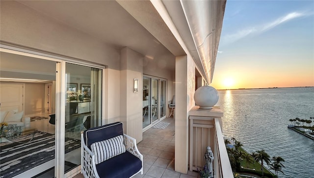 balcony at dusk with a water view