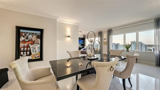 dining room with ornamental molding and light tile floors