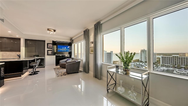 living room with plenty of natural light and light tile flooring