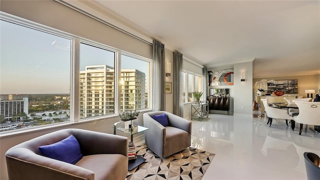 living room with ornamental molding, light tile flooring, and a wealth of natural light