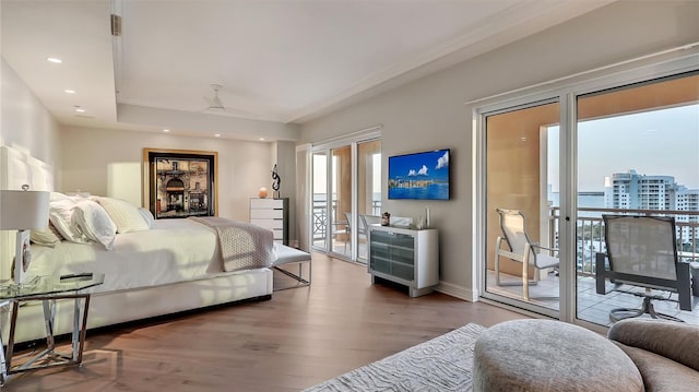 bedroom with access to outside and light hardwood / wood-style flooring