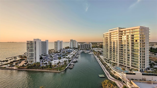 aerial view at dusk with a water view