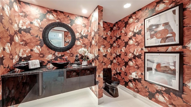 bathroom with vanity and tile flooring