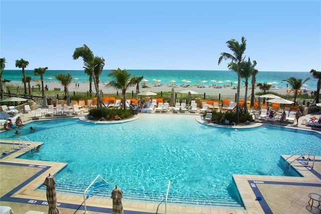 view of swimming pool with a water view