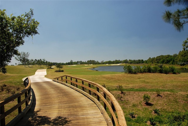 view of nearby features with a yard and a water view