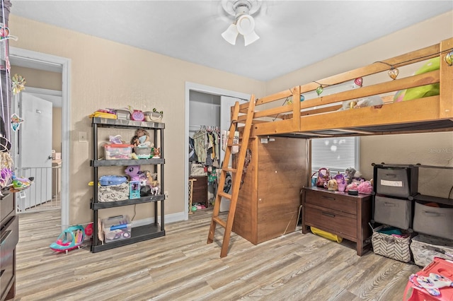 bedroom featuring light hardwood / wood-style floors and a closet