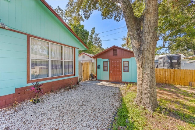 view of side of property with an outdoor structure