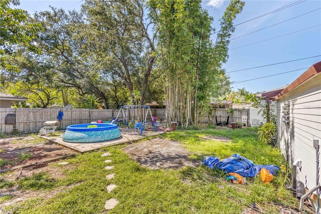 view of yard featuring a pool